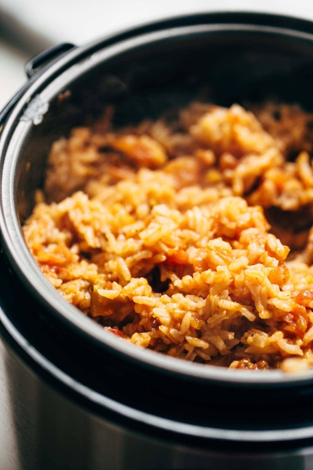 Spicy Brazilian Burrito Bowls recipe featuring seasoned rice and beans, garlic cilantro lime slaw, and crispy fried plantains. So good // almost vegan. | pinchofyum.com