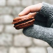 Lindsay holding a macaron.