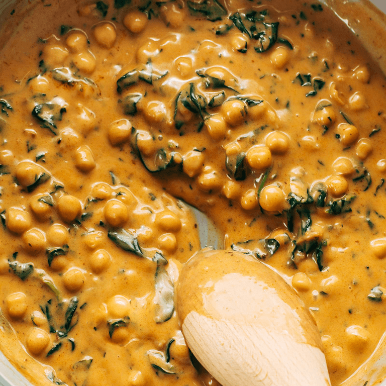 Curry chickpeas in a pan.